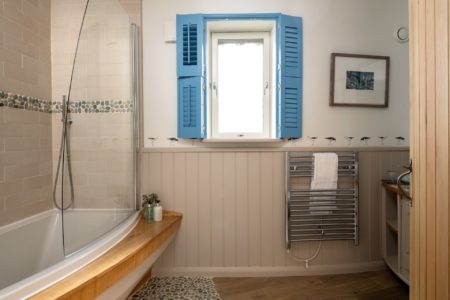bathroom with boatshaped shower bath